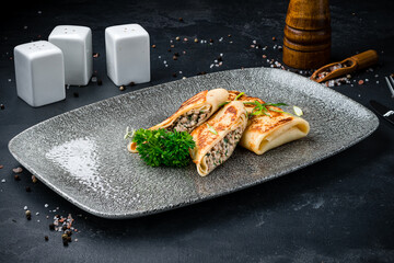 Fried sweet thin pancakes with beef mince and herbs.