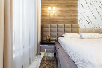Luxury bedroom interior with parquet and wood marble walls
