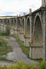 Fototapeta premium View of the abandoned old Mokrinsky railway bridge. Russia, the village of Mokry, the bridge was built in 1918