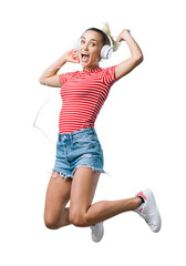 Cheerful woman listening to music and jumping