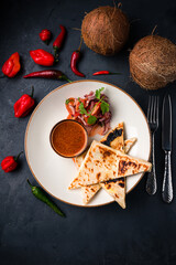Flatbread stuffed with sauce and fresh vegetable salad.