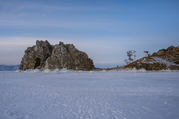 Shamanka Rock. sunset. Olkhon Island. snowy and frosty winter.