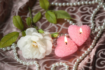 white beautiful rose with candles. romantic. copy space
