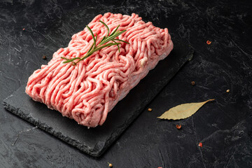 Minced pork and beef raw on a dark background.