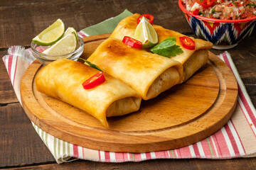 Mexican chimichanga, a traditional snack with minced meat wrapped in a tortilla.