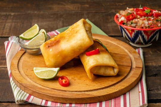Spicy dish of Mexican cuisine, traditional fast food, chimichanga.