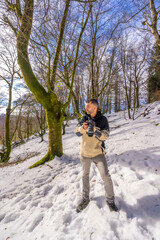 Portrait of a photographer man in snow enjoying winter photography