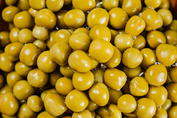 A pile of canned green peas. 