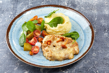 pork with mashed potato and vegetables