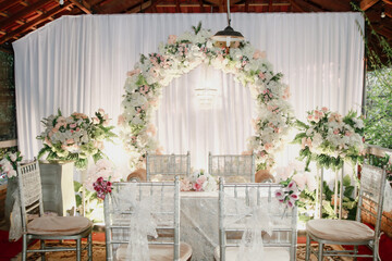Decorating of chairs and tables with flower decoration