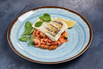 white fish with rice and vegetables