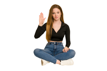 Young redhead woman sitting on the floor cut out isolated having some great idea, concept of creativity.