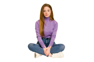 Young redhead woman sitting on the floor cut out isolated showing a dislike gesture, thumbs down. Disagreement concept.