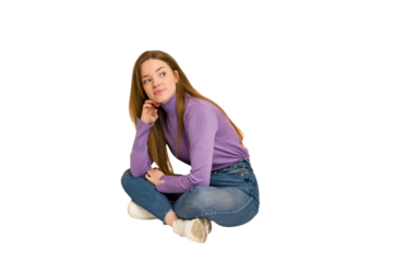 Young redhead woman sitting isolated cut out