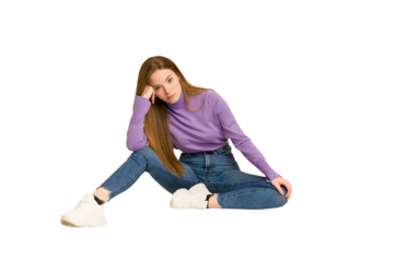 Young redhead woman sitting isolated cut out