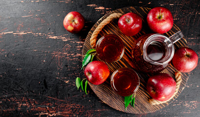Apple juice on a wooden tray. 