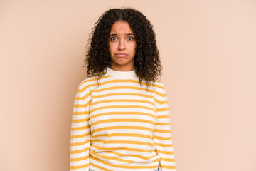 Young african american curly woman isolated sad, serious face, feeling miserable and displeased.