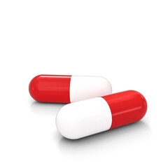 white and red medicine capsules.
