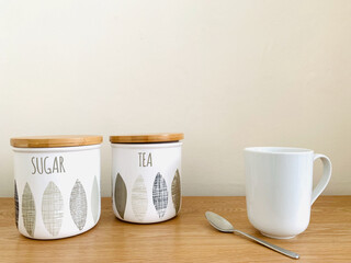 Mug with tea and sugar jars