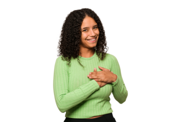 Young african american curly woman isolated has friendly expression, pressing palm to chest. Love concept.