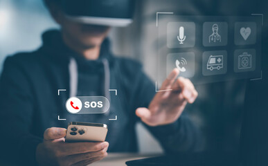 Man hand hold smartphone SOS Emergency app in home, call phone, Chat message icon, Emergency application from smartphone for elderly, technology concept.Old hand touch mobile phone and call for help.