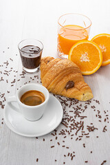 Breakfast with coffee, orange juice and chocolate brioches
