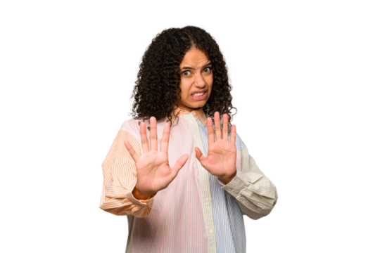 Young african american curly woman isolated rejecting someone showing a gesture of disgust.