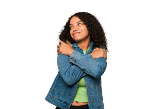 Young african american curly woman isolated hugs, smiling carefree and happy.