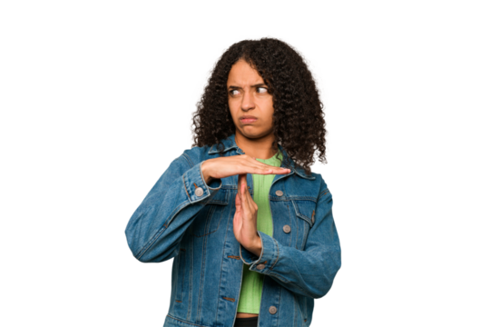 Young african american curly woman isolated showing a timeout gesture.