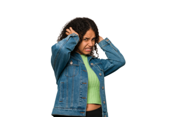 Young african american curly woman isolated covering ears with hands.