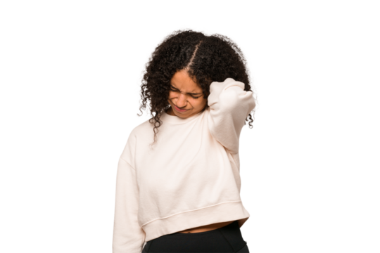 Young african american curly woman isolated having a neck pain due to stress, massaging and touching it with hand.