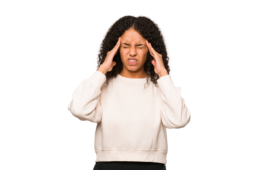 Young african american curly woman isolated touching temples and having headache.