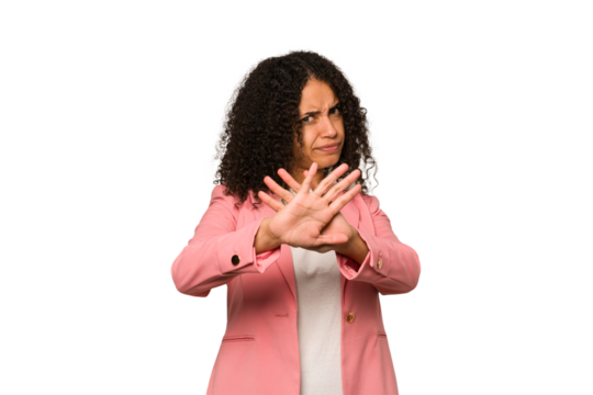 Young african american curly woman isolated doing a denial gesture