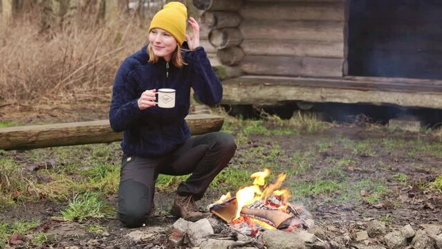Young woman outdoors drinking hot chocolate