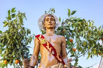 Detail  of the Patron Saint Sebastian (San Sebastian)  in procession through the streets of the city of Huelva