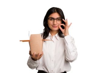 Young business indian woman eating takeaway noodles cut out isolated with fingers on lips keeping a secret.