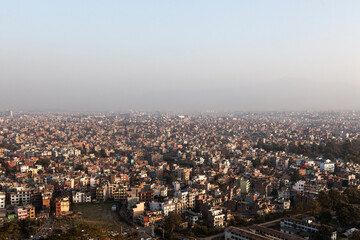 Fototapeta premium Kathmandu city, Nepal. Aerial view of the city. Image has space for text at the top. Panorama of Kathmandu in the morning mist.