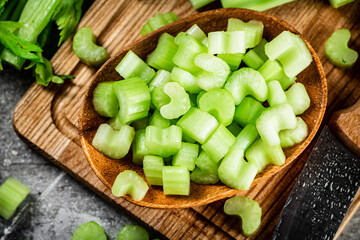 Sliced celery on a cutting board. 