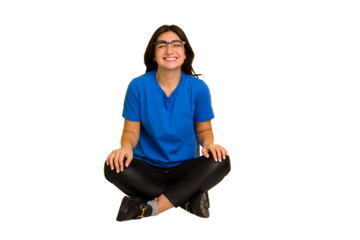 Young indian woman sitting on the floor cut out isolated laughs and closes eyes, feels relaxed and happy.