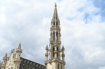 Fototapeta na wymiar Bruxelles, Belgium: Town Hall tower. Historical buildings in Brussels. Grand Place.