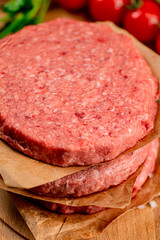 Fresh raw burger on the table. 