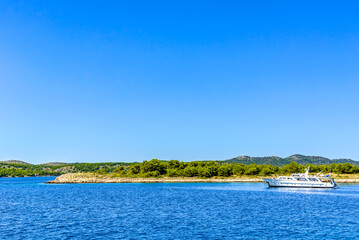 Naklejka premium Luxury yacht sail boat near sea coast of croatian islands.