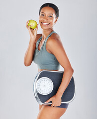 Health, scale and portrait of woman with apple on diet for weight loss, workout and healthy...