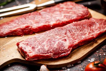 Raw steak on a cutting board. 