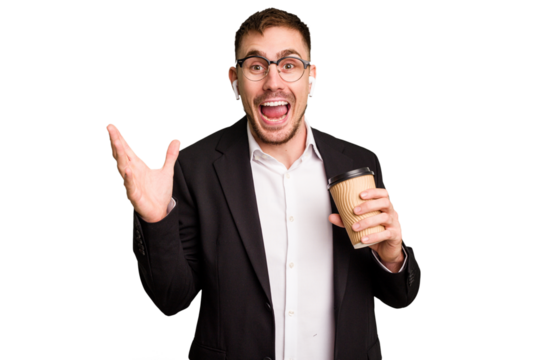 Young business caucasian man drinking a coffee isolated cutout receiving a pleasant surprise, excited and raising hands.