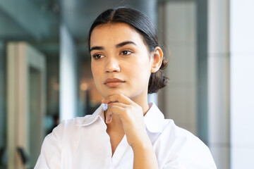 Worried South asian office worker woman thinking or planning