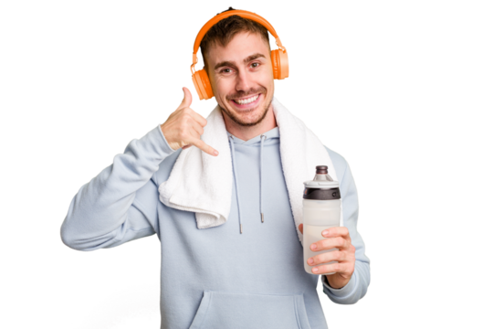 Young caucasian sporty man ready to start his gym day showing a mobile phone call gesture with fingers.