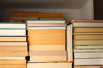 Fototapeta premium Big pile of books on the table.