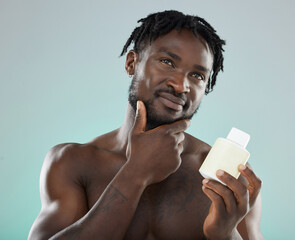 Skincare, black man and cream for cosmetics, wellness and natural beauty with guy on grey studio...