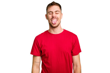Obraz premium Young caucasian man cut out isolated funny and friendly sticking out tongue.